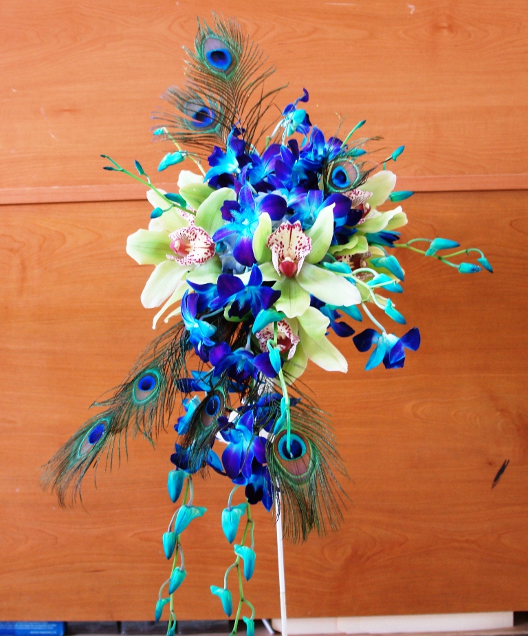 This one incorporates peacock feathers blue dendrobium orchids 
